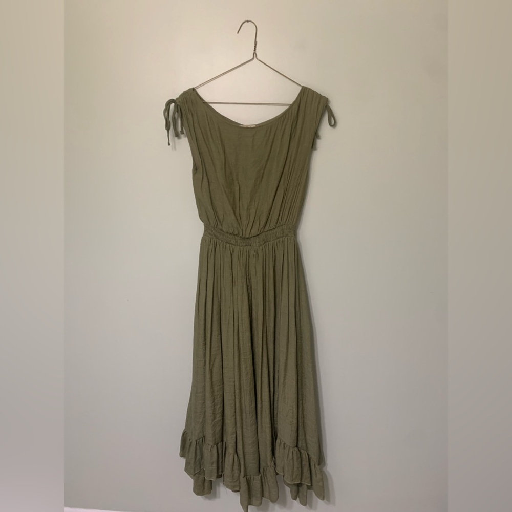 Mia Joy — long dark green sleeveless dress with ruffles at bottom
